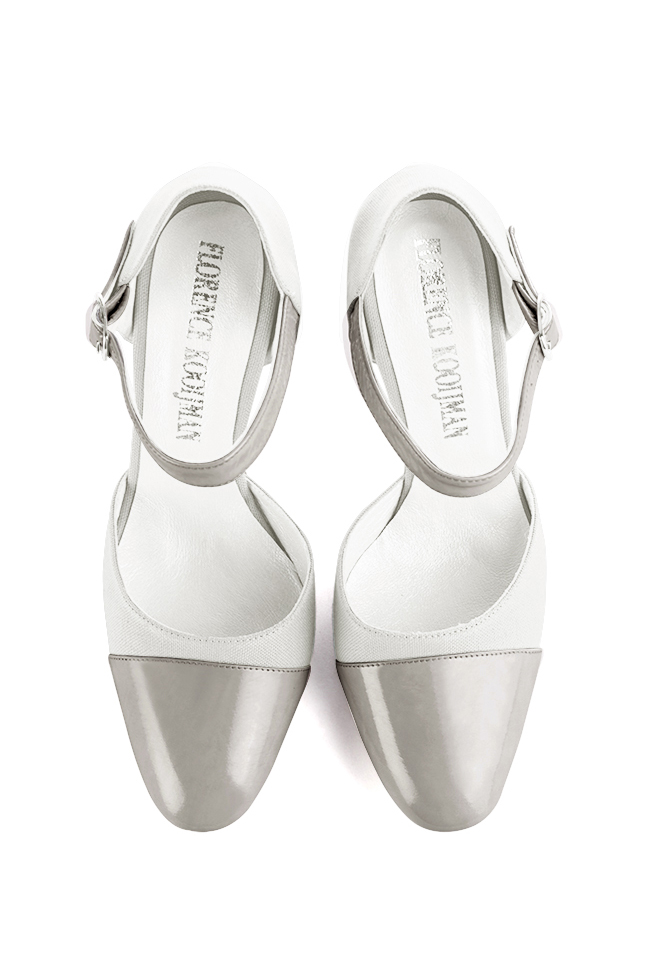French elegance and refinement for these pearl grey and pure white dress open side shoes, with an instep strap, 
                available in many subtle leather and colour combinations. Its high vamp and fitted strap will give you good support.
To personalize or not, according to your inspiration and your needs.  
                Matching clutches for parties, ceremonies and weddings.   
                You can customize these shoes to perfectly match your tastes or needs, and have a unique model.  
                Choice of leathers, colours, knots and heels. 
                Wide range of materials and shades carefully chosen.  
                Rich collection of flat, low, mid and high heels.  
                Small and large shoe sizes - Florence KOOIJMAN